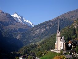 Holy Blood church and the snow-capped Grossglockner in the high tauern mountain range, Austria, Carinthia