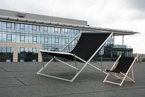 two beach chairs on roof, poland, warsaw