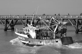 black and white photo with fishing vessel