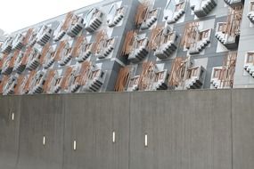 The building of the Scottish Parliament behind a concrete wall