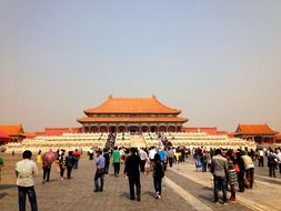 people on pavement at hall of supreme harmony in forbidden city in china, beijing