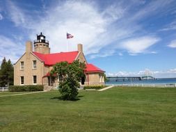 Old Mackinac Point Lighthouse on the background of the bridge in Michigan