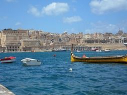 boats at pier in view of waterfront, malta, valletta