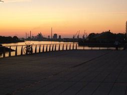 sunset afterglow in sky above harbour, germany, bremen