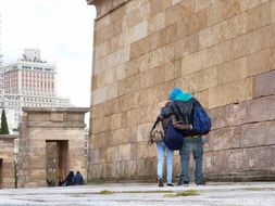 back view of young couple in love on street, spain, madrid