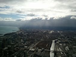 aerial view of city under stormy clouds, usa, illinois, chicago