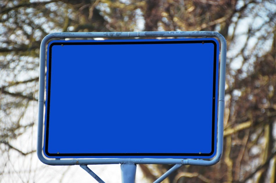 town blue sign board road