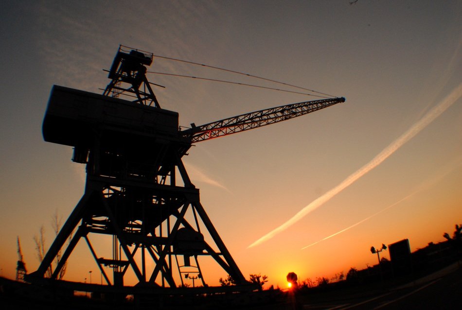 crane silhouette at sunset sky