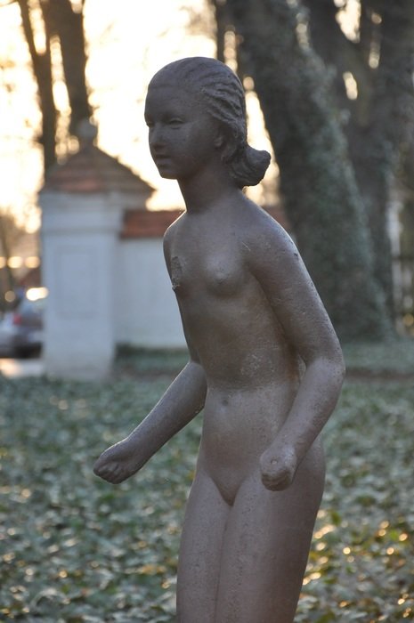 damadged girl sculpture in park, poland, mazowsze, radziejowice