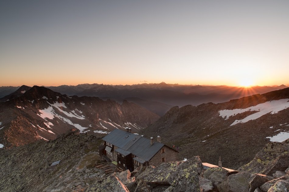 grand sunset snow mountain house top