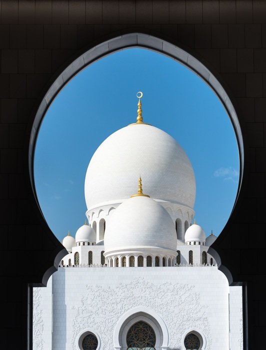 white mosque abu dhabi on a sunny day