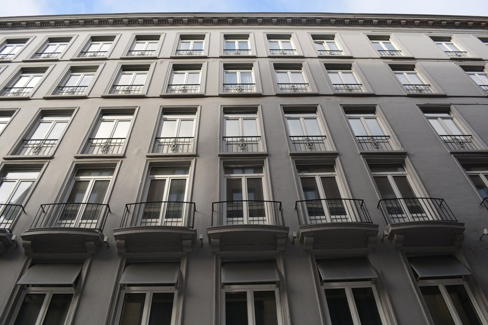 grey facade building with many windows