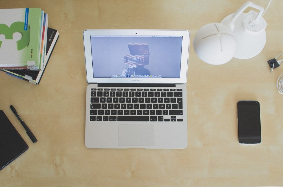 home office, top view of laptop, lamp and notebook on desk