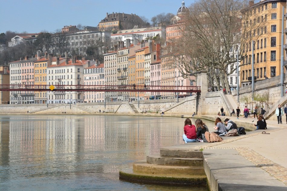 people sit on the pier in lyon