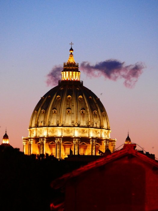 illuminated dome of st peterâs basilica at evening sky, italy, rome, vatican