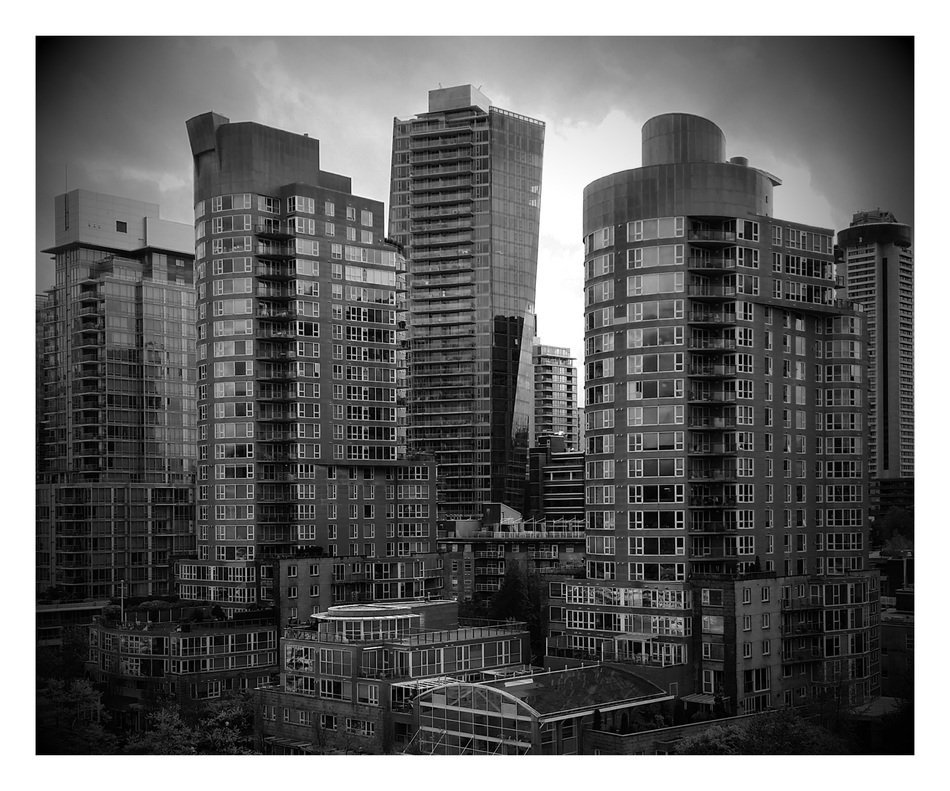 Grey photo of high buildings in town