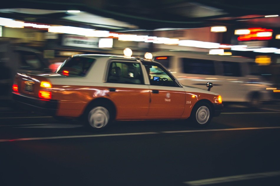 fast taxi cab on night street, japan, kyoto