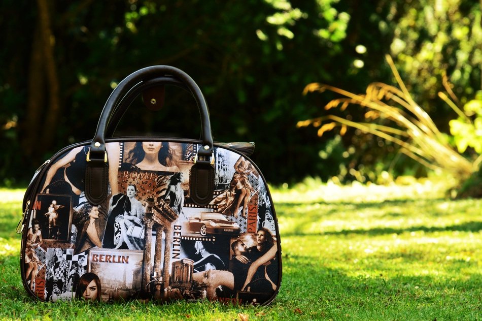 ladies picture on a travel bag on lawn
