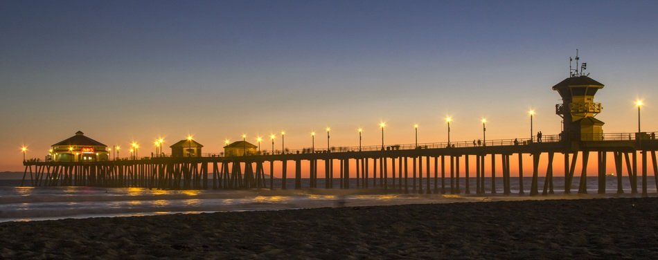 illuminated pier at dusk, usa, california, huntington beach