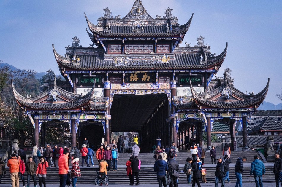 people at gate of dujiangyan ancient irrigation system, china, sichuan