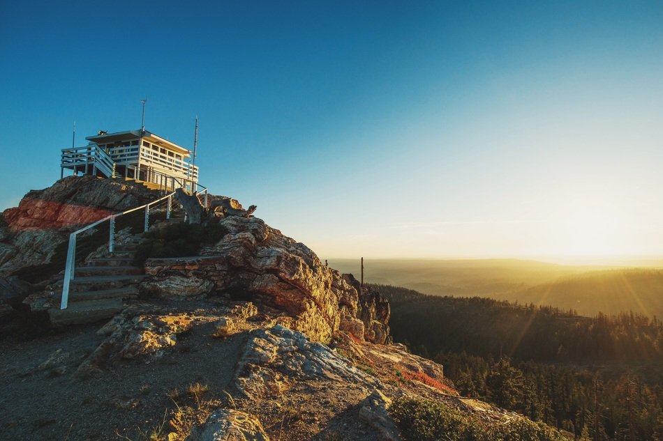 hut on moutain summit at sunrise