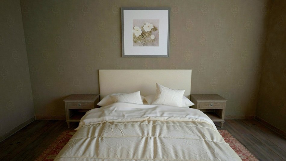 small bedroom with picture on wall