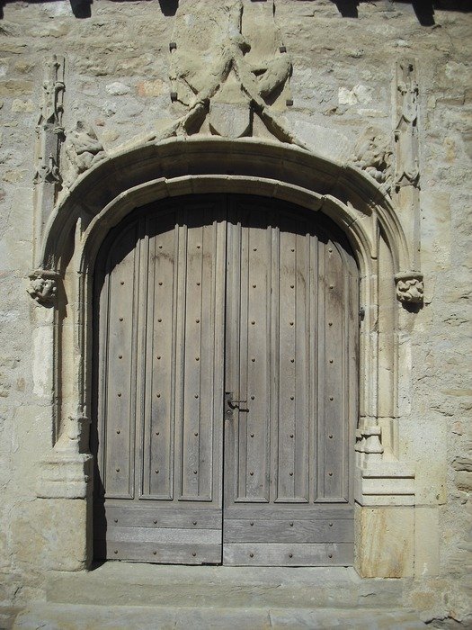 wooden door in medieval gateway