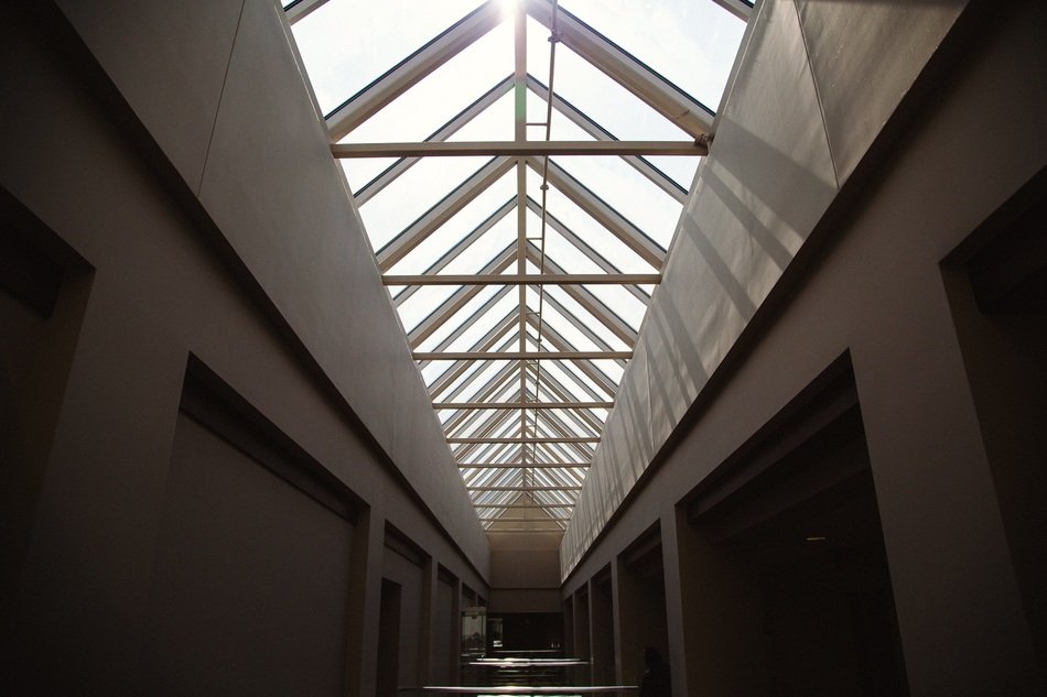 hallway with skylight ceiling in building