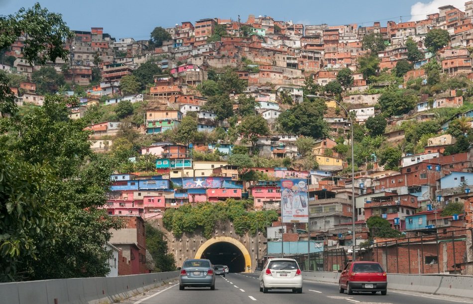 colorful house on mountain above tunnel, venezuela, barrio