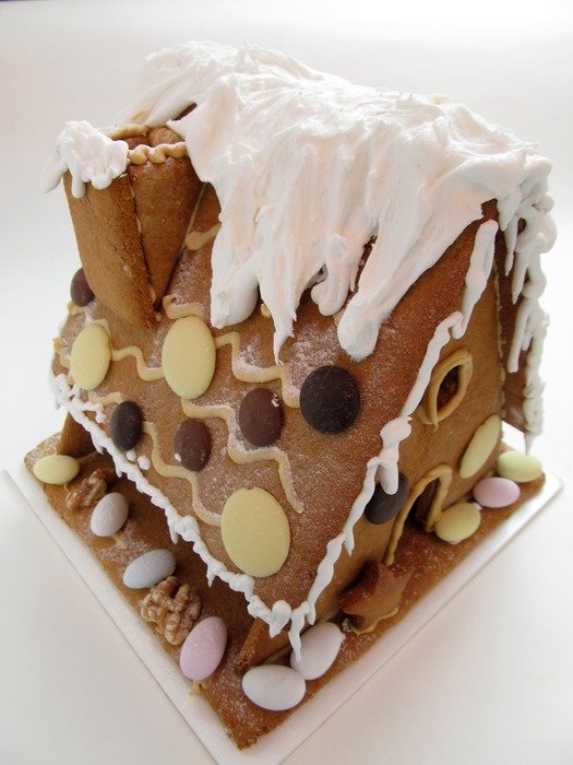 christmas cake in form of house with candy
