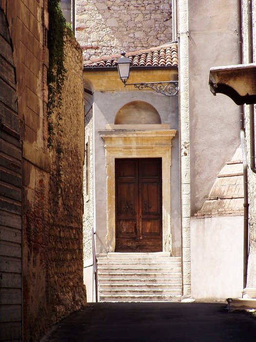 lantern on wall at entrance door of old house