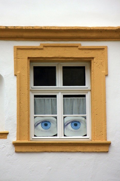 decoration of eyes looking from window