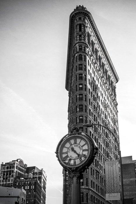 black and white photo of the flatiron building architecture clock