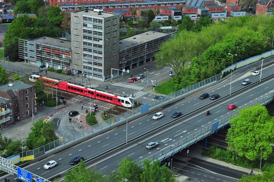 transport on overpass across rail road in city, netherlands