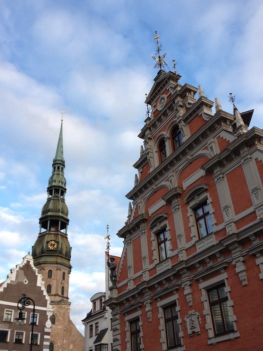 House of the Blackheads and St. Peter's Church at sky, latvia, riga