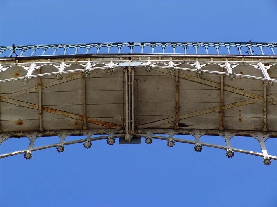 bottom view of old pedestrian bridge at sky, germany, berlin