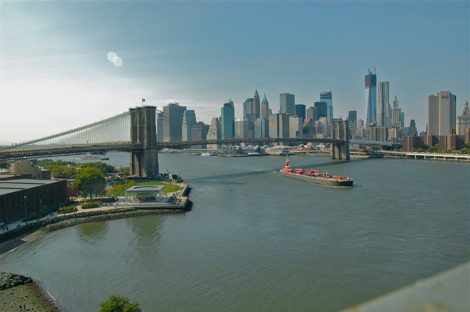 manhattan bridge across east river at city skyline, usa, nyc