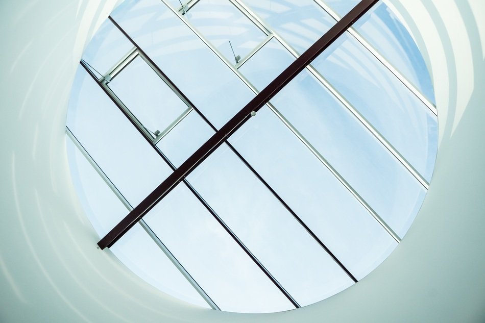 metal framed round window on roof