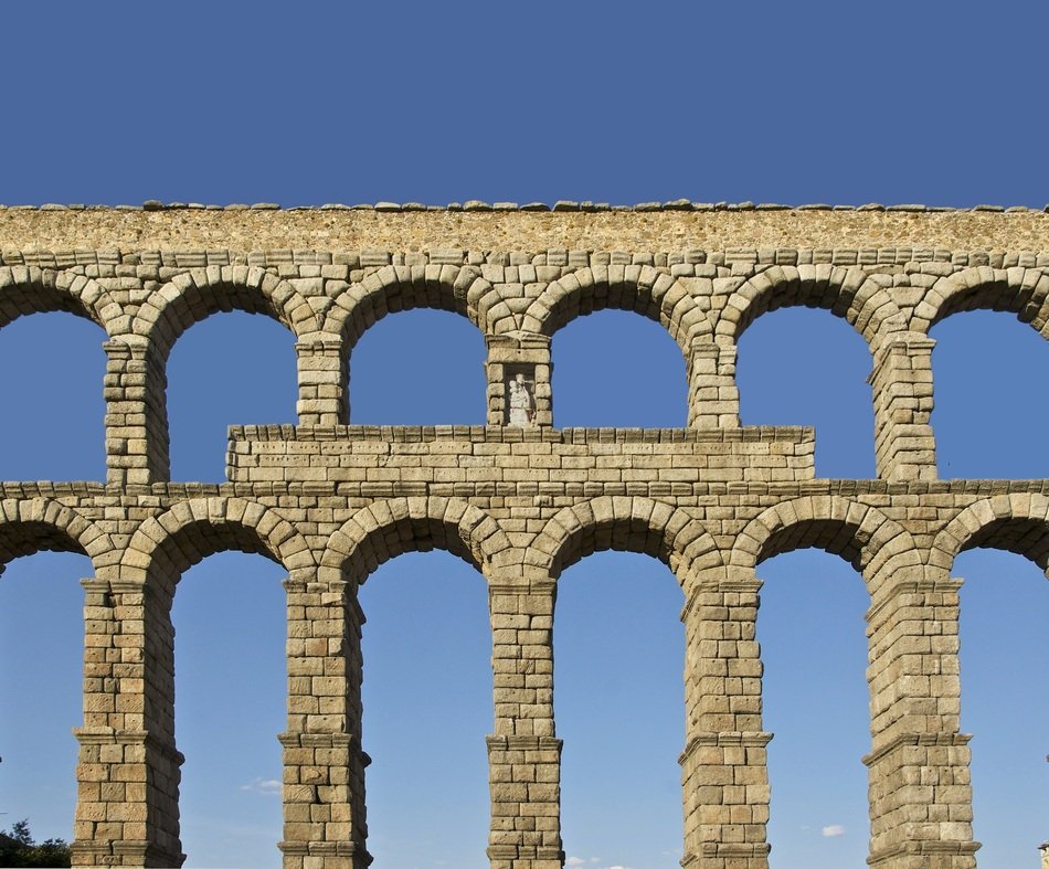 ancient roman aqueduct at sky, segovia, spain