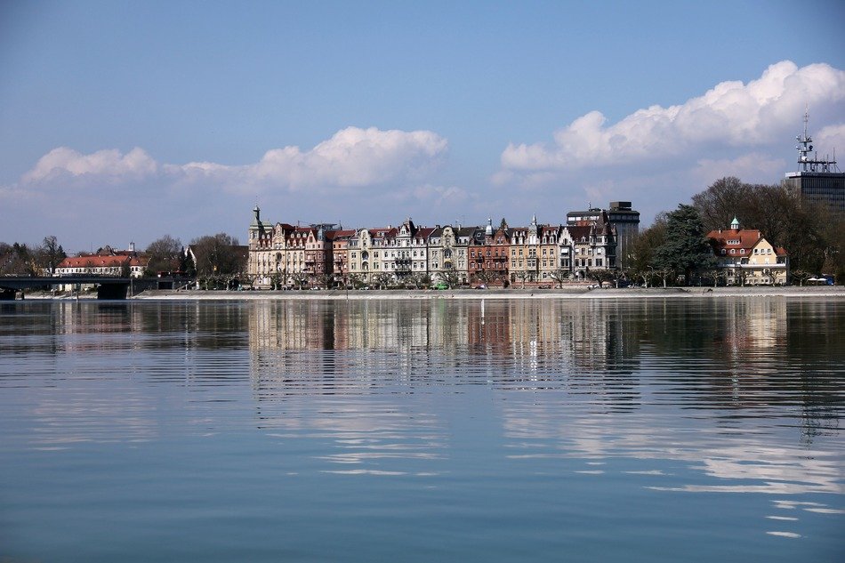 blue lake water building reflection