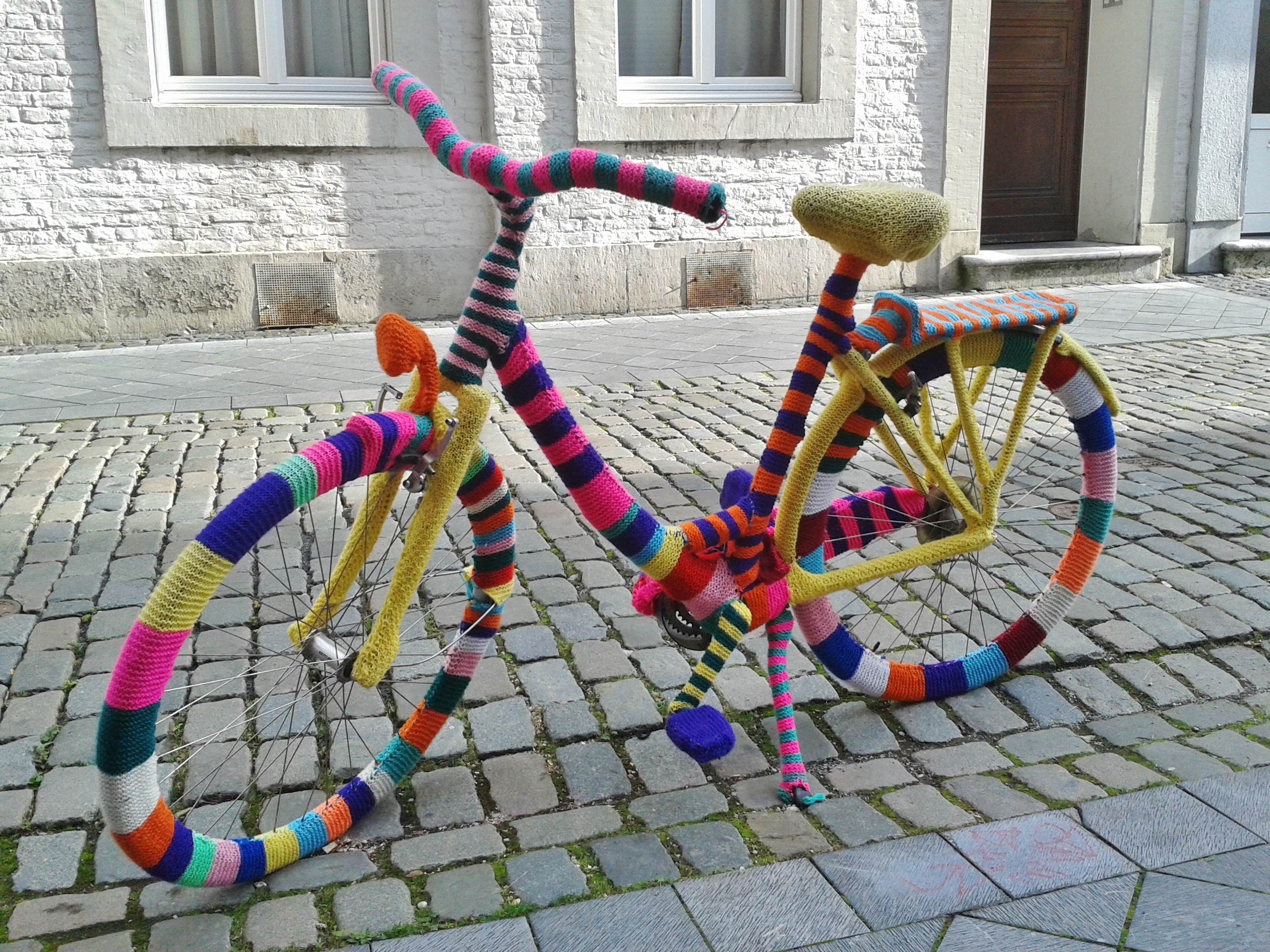 Vintage Ladies Bike Decorated With Colorful Knitting On Pavement   10074 