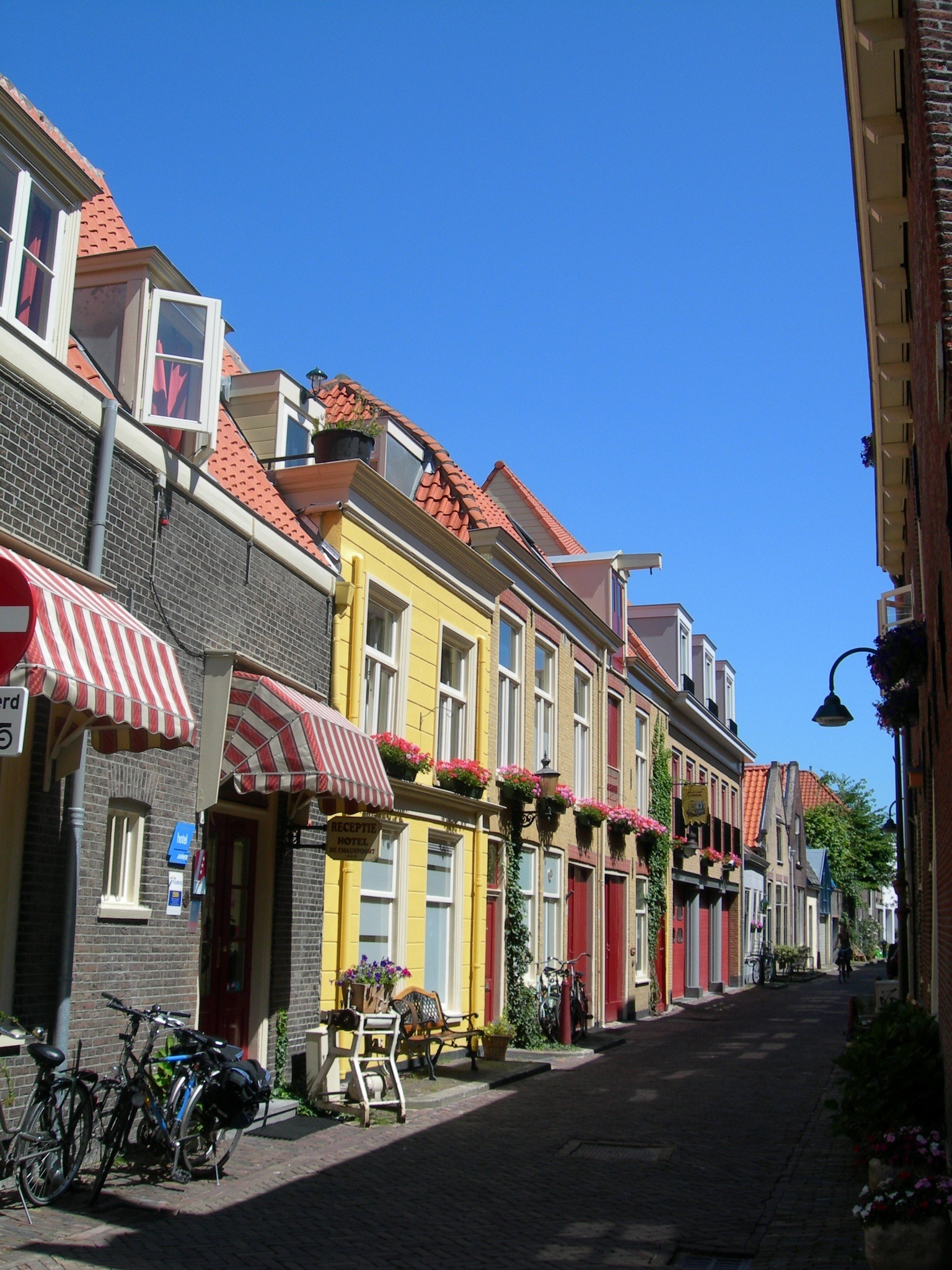 long-colorful-street-with-a-shops-free-image-download