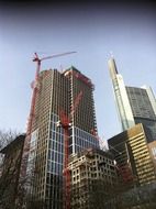 tower cranes at skyscrapers under construction, germany, frankfurt