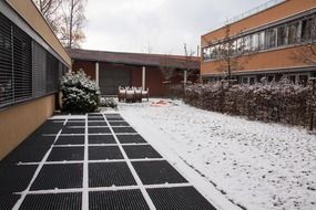 snowy yard of modern building, new zealand