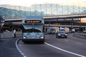 grey bus on road in city