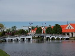 Netherlands flags on bridge above water