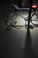 bicycle with shadow at night street