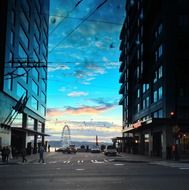 ferris wheel between facades at sunset sky, usa, washington, seattle