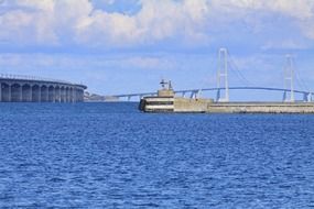 distant suspension bridge above water