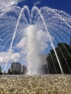 fountain splashes on a city street